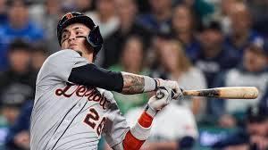 Detroit tigers player swinging a bat during a game.